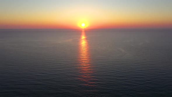 Aerial view to beautiful sunrise over the sea alt