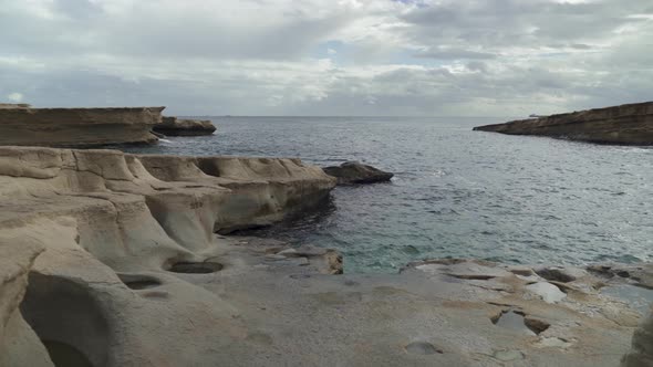 Walking on St Peters Pool Beach on a Cloudy Winter Day in Malta