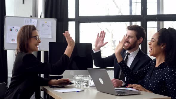 Excited Business Multiracial Colleagues Did a Great Job They Discussing New Project Generating New alt