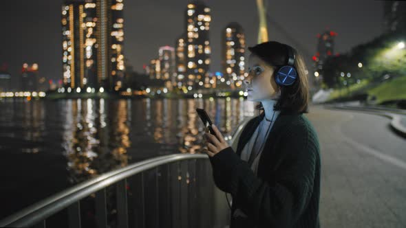 Girl Listening To Music At Night 