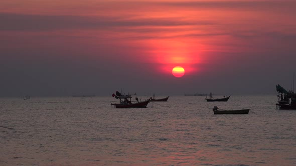 Ocean sunset and fishing boats.