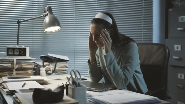 Stressed office worker with headache