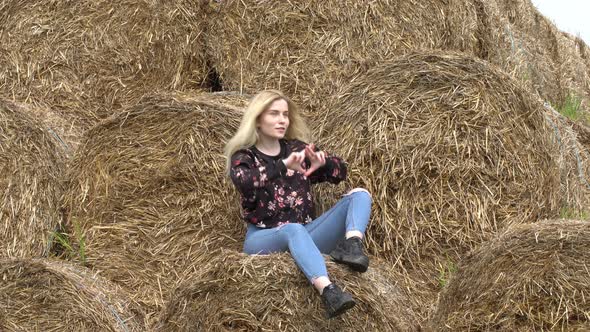 Girl dancing sitting on a stack alt