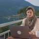 Arab Young Muslim Woman in Hijab Sits Balcony Using Laptop Middle Eastern Female Working Remote From - VideoHive Item for Sale