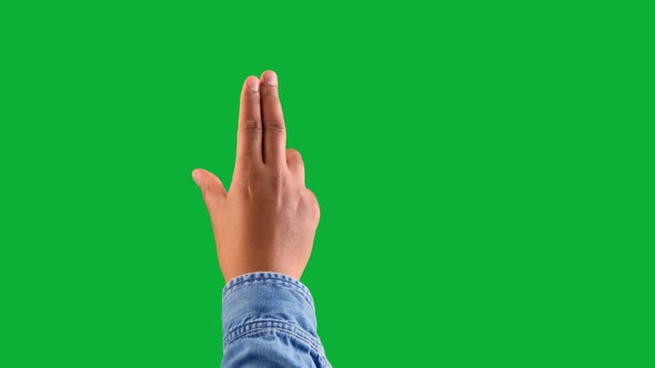Mixed Race Deep Skin Tone Male Hand Makes a Zoom Gesture on Chromakey Green 