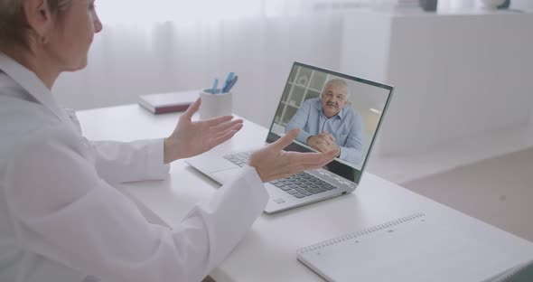 Medical Consultation Online By Video Chat, Middle-aged Man Is Calling To His Therapist or alt