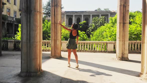 Woman Tourist Takes Selfie In Historical Landmark alt