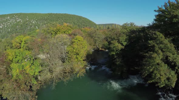 Aerial shot of Krka River and forest alt