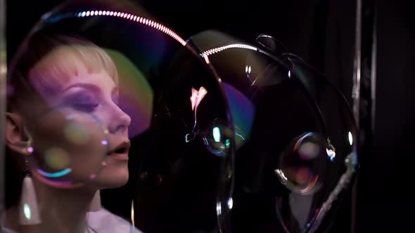 Closeup Cute Girl Does Tricks with Soap Bubbles She Blows Lot of Small Bubbles Into Big Bubbles alt