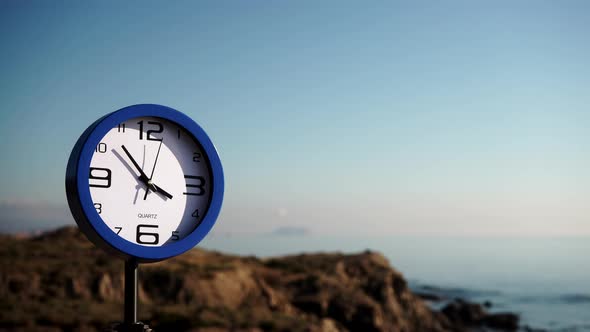 Clock Ticking against Sea Coast. Holidays alt