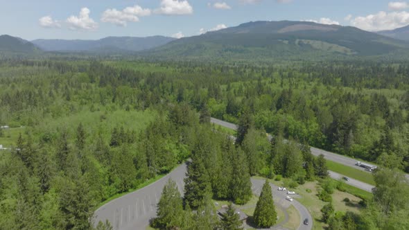 Aerial view of rest stop in Bellingham, Washington with a tilt up to reveal the Pacific Northwest la alt