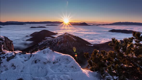 Sunset in Frozen Winter Mountains in Snowy Alps Nature with Foggy Clouds Motion Fast alt