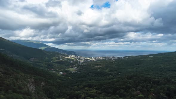 Time-lapse of shadows from clouds passing over a beautiful valley alt