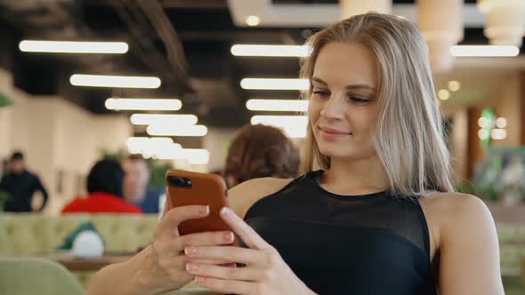 Lady Making Selfie Photo on Smartphone Inside Cafe