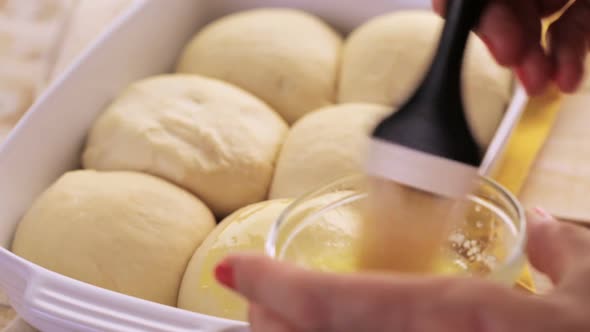 Baking fresh homemade dinner rolls. alt