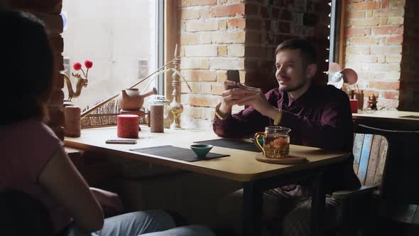 Man Takes a Photo of His Girlfriend