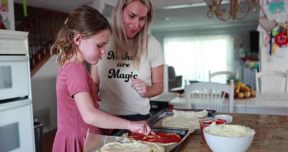 Mother And Daughter Make Pizza