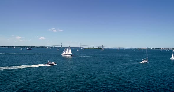 Sailboats entering and leaving Mt. Hope Bay in Newport Rhode Island as well as returning from Block alt