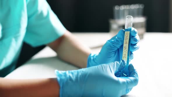 Doctor holding a coronavirus COVID-19 vaccine