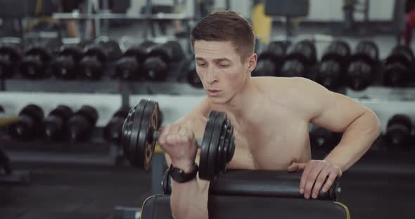 Man Doing Biceps Lifting Barbell