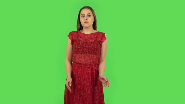 Tender Upset Girl in Red Dress Is Shrugging and Sighing. Green Screen alt