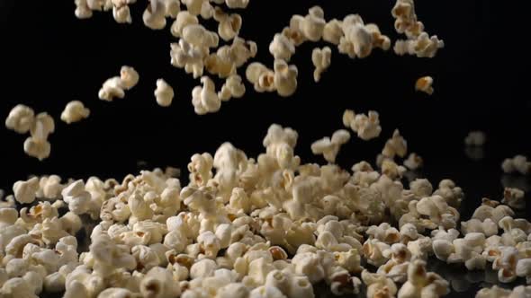 Popcorn Falls on a Black Surface alt