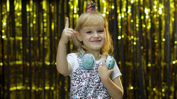 Child Dances, Listens Music on Headphones. Little Kid Girl Dancing, Having Hun, Relaxing, Enjoying alt