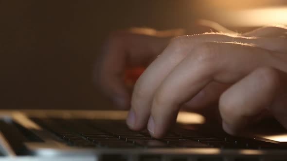 Developer's Hands Typing Commands on Laptop Keyboard alt