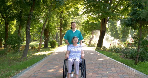 Nurse Spending Time with Senior Woman in Wheelchair
