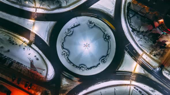 Aerial View Night Timelapse of Roundabout Road with Circular Cars in Small European City Steady Shot alt