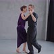 Full Growth Shot of a Pair Dancing Tango in Grey Studio with Large Windows - VideoHive Item for Sale