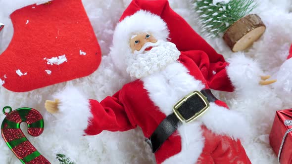 Different Christmas Objects Lay Out on Snow Background alt