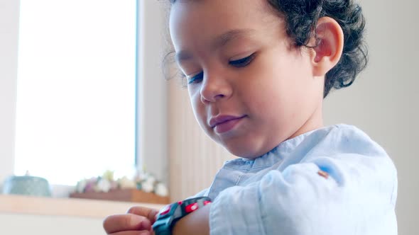 Cheerful African Kid Using Smartwatch