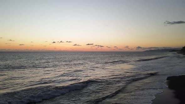 Slow aerial shot of the sunset at the beach in Osa Peninsula, Costa Rica alt