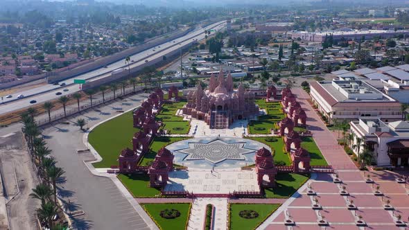 Flying towards the BAPS Shri Swaminarayan Mandir Hindu temple in Chino California alt