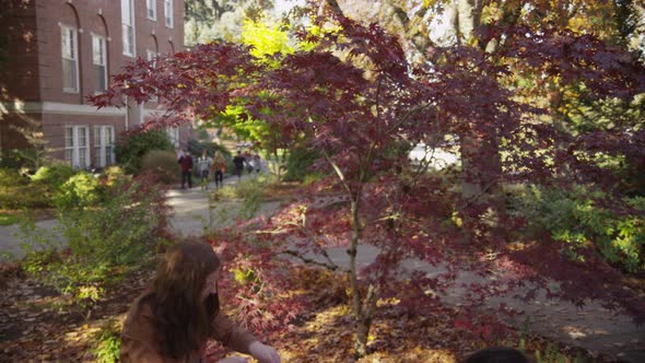 College students on campus meet in courtyard