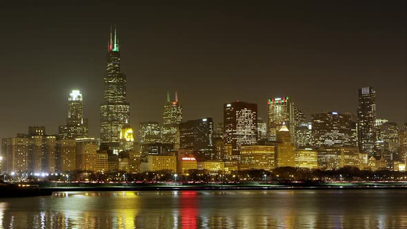 Night timelapse of Chicago. Airplanes visible. alt