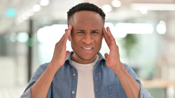 Portrait of Tired Casual African Man Having Headache  alt