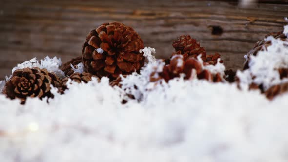 Pine cones decoration on fake snow alt