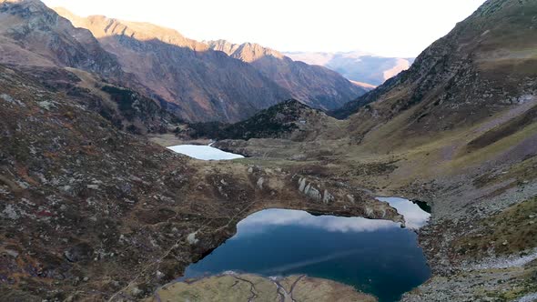 Lake Saussat and Lac d'Espingo mountain lakes located in Haute-Garonne, France, Aerial fly alt