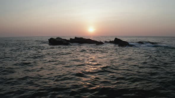 Aerial View of the Ocean with Waves and Rocks at Dawn on the Southern Part of the Island of Sri