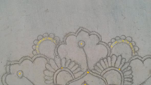 Woman Drawing the Big Mandala at Sand and Dancing in Empty Beach Top View Above From Drone alt