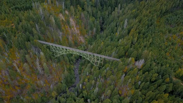 Aerial orbit of abandoned Vance Creek Bridge in the pacific northwest state of Washington. alt