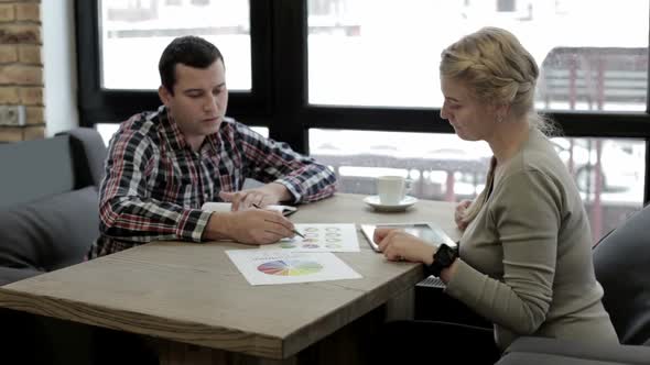 Business meeting of financial specialists and discussion of the company's business growth. alt