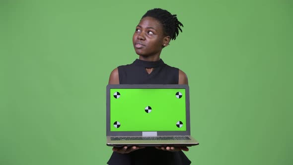 Young Beautiful African Businesswoman Showing Laptop