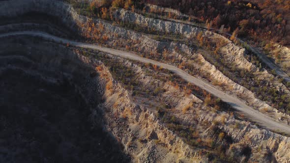 Aerial view of the walls of an old abandoned quarry.