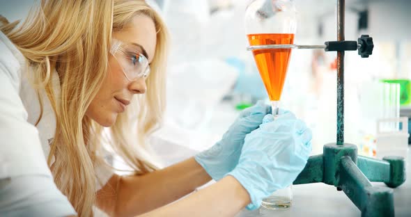 Female Student of Chemistry Working in Laboratory