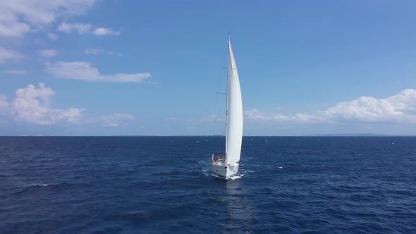 Yacht Sailing at Sunset During a Storm alt