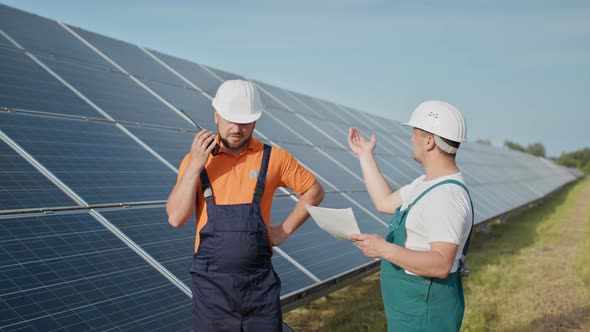 Technician of Energy Checking the Solar Cell Panels at Solar Farm Energy alt