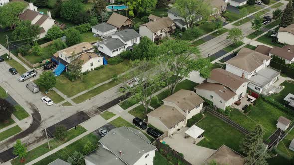 Aerial Top Drone View of Road Repairs in the Suburbs on the Street with Many Houses alt